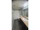 Bright bathroom featuring a tub/shower combo, granite countertops and modern vanity at 8101 W Flamingo Rd # 2110, Las Vegas, NV 89147