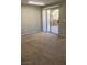 Spacious bedroom featuring neutral carpet, sliding glass door leading to a private balcony at 8101 W Flamingo Rd # 2110, Las Vegas, NV 89147