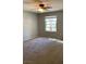 Bedroom with a ceiling fan and a view to mature trees at 8101 W Flamingo Rd # 2110, Las Vegas, NV 89147
