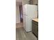 Kitchen with gray cabinets, stainless steel refrigerator and vinyl floors at 8101 W Flamingo Rd # 2110, Las Vegas, NV 89147