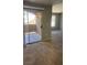 Living room with sliding glass doors leading to a patio and neutral colored carpet throughout at 8101 W Flamingo Rd # 2110, Las Vegas, NV 89147