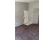 Living room featuring a white front door and neutral carpet at 8101 W Flamingo Rd # 2110, Las Vegas, NV 89147