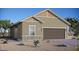 Charming single-story home with a two-car garage and desert landscaping offers an inviting curb appeal at 86 Sonata Dawn Ave, Henderson, NV 89011