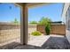 The backyard features a covered patio with a paved area surrounded by block walls at 9136 Cocowoods Pl, Las Vegas, NV 89148