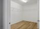 Walk-in closet with wood floors and shelving at 9136 Cocowoods Pl, Las Vegas, NV 89148