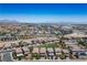 A wide shot of a vibrant neighborhood with manicured lawns and well-maintained homes at 9136 Cocowoods Pl, Las Vegas, NV 89148