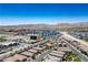 Expansive shot featuring mountain views beyond a bustling community and cityscape at 9136 Cocowoods Pl, Las Vegas, NV 89148