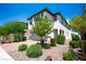 Attractive two-story home with appealing desert landscaping and a welcoming facade at 9136 Cocowoods Pl, Las Vegas, NV 89148