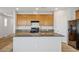The kitchen features granite countertops, a center island with a sink, and stainless steel appliances at 9136 Cocowoods Pl, Las Vegas, NV 89148