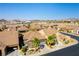 An aerial view of homes in a desert neighborhood, showing desert landscaping, and barrel tile roofs at 1004 Viale Placenza Pl, Henderson, NV 89011