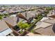 Aerial view of a well-maintained neighborhood featuring homes with tile roofs and mature landscaping at 1004 Viale Placenza Pl, Henderson, NV 89011