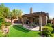 Inviting backyard with patio cover and space for outdoor dining and entertaining at 1004 Viale Placenza Pl, Henderson, NV 89011