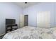 Bedroom with walk-in closet, neutral carpet, and ensuite bathroom access at 1004 Viale Placenza Pl, Henderson, NV 89011