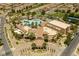 Bird's eye view of a community center with a pool, lush greenery, and well-manicured landscaping at 1004 Viale Placenza Pl, Henderson, NV 89011