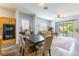 Inviting dining area adjacent to the kitchen with outdoor views and stylish decor at 1004 Viale Placenza Pl, Henderson, NV 89011