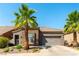 Beautiful single-story home with desert landscaping, a two-car garage, and barrel tile roof at 1004 Viale Placenza Pl, Henderson, NV 89011
