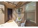 Charming front porch with decorative lighting and ample natural light streaming through windows at 1004 Viale Placenza Pl, Henderson, NV 89011