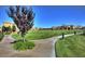 A large grassy area surrounded by a walking path for residents to enjoy at 1004 Viale Placenza Pl, Henderson, NV 89011