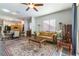 Warm and inviting living room connected to the kitchen, featuring stylish furnishings and natural light at 1004 Viale Placenza Pl, Henderson, NV 89011