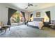 Serene main bedroom featuring a sliding glass door to the backyard and neutral decor at 1004 Viale Placenza Pl, Henderson, NV 89011