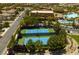 Aerial view of tennis courts in a community with trees and parking at 1004 Viale Placenza Pl, Henderson, NV 89011