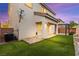 Spacious backyard has a covered patio, and easy to maintain artificial grass at 10557 Bandera Mountain Ln, Las Vegas, NV 89166