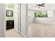 Neat bathroom adjacent to kitchen with nice mirror and vanity at 10557 Bandera Mountain Ln, Las Vegas, NV 89166