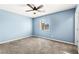 Bedroom featuring neutral walls, carpet flooring, window and ceiling fan at 10557 Bandera Mountain Ln, Las Vegas, NV 89166