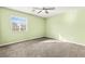 Bedroom featuring neutral walls, carpet flooring, a window, and a ceiling fan at 10557 Bandera Mountain Ln, Las Vegas, NV 89166