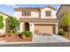 Charming two-story home features a tile roof and a well-maintained front yard at 10557 Bandera Mountain Ln, Las Vegas, NV 89166