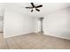 Spacious living room featuring tile flooring and a modern ceiling fan at 10557 Bandera Mountain Ln, Las Vegas, NV 89166