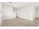 Living room featuring tile floors and staircase access to upper floors at 10557 Bandera Mountain Ln, Las Vegas, NV 89166