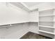 Walk-in closet offering ample storage with shelving and rods, providing convenient organization solutions at 10557 Bandera Mountain Ln, Las Vegas, NV 89166