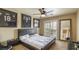 Comfortable bedroom with a king bed, sports decor, and access to the balcony at 11241 Pentland Downs St, Las Vegas, NV 89141