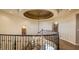 Stately foyer with ornate chandelier, curved staircase, and elegant architectural details at 11241 Pentland Downs St, Las Vegas, NV 89141