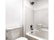 Full bathroom features white tile surround, a dark bronze showerhead, and an undermount sink at 1136 Casady Hollow Ave, Henderson, NV 89012