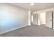 Spacious bedroom with neutral carpet and an open doorway to a walk-in closet at 1136 Casady Hollow Ave, Henderson, NV 89012