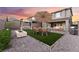 Inviting backyard featuring artificial turf, a swing, outdoor furniture, and a grill at 12457 Sunset Sage Ave, Las Vegas, NV 89138