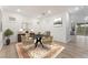 Dining area with a round table, seating for four, and a view of the backyard at 12457 Sunset Sage Ave, Las Vegas, NV 89138