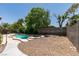 Backyard featuring a small inground pool and stone landscaping at 1453 Doggett Ave, Las Vegas, NV 89123