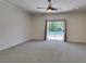 Large bedroom with a ceiling fan and access to a fenced in backyard pool at 1453 Doggett Ave, Las Vegas, NV 89123