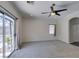 Bedroom with ceiling fan and backyard access at 1453 Doggett Ave, Las Vegas, NV 89123