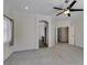 Bedroom with neutral walls, plush carpet, and access to other rooms at 1453 Doggett Ave, Las Vegas, NV 89123