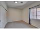 Empty bedroom with carpet, closet, and a bright window at 1453 Doggett Ave, Las Vegas, NV 89123