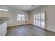 Dining area with stylish flooring, natural light, and access to the backyard at 1453 Doggett Ave, Las Vegas, NV 89123