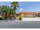 Charming single-story home with a three-car garage, mature landscaping, and desert landscaping at 1453 Doggett Ave, Las Vegas, NV 89123
