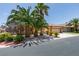 Charming single-story home with a three-car garage and tropical landscaping at 1453 Doggett Ave, Las Vegas, NV 89123