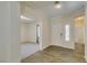 Bright foyer featuring wood-look flooring and views into connecting rooms at 1453 Doggett Ave, Las Vegas, NV 89123