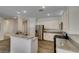 Well-lit kitchen featuring granite countertops, stainless appliances, and a convenient breakfast bar area at 1453 Doggett Ave, Las Vegas, NV 89123