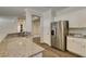Bright kitchen showcasing granite countertops, stainless appliances, and eat-in counter at 1453 Doggett Ave, Las Vegas, NV 89123